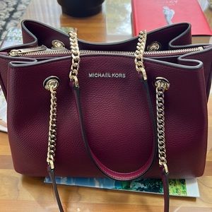 Michael Kors shoulder bag. Color is plum. New condition.
